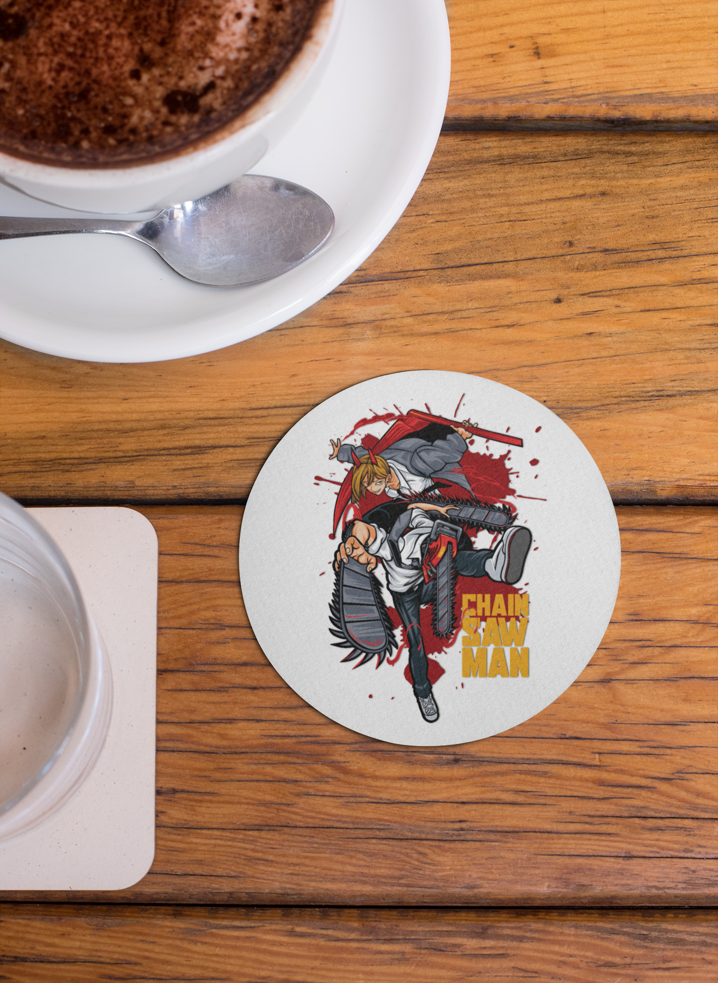 Chainsaw Man coaster featuring vibrant artwork of the character in action on a round design
