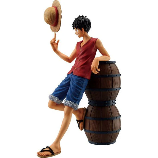 One Piece Luffy Ichibansho figure in casual pose with hat, leaning on barrels
