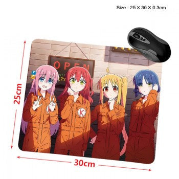 Unbranded anime mouse pad showing four anime girls in orange jumpsuits under an OPEN sign with black mouse