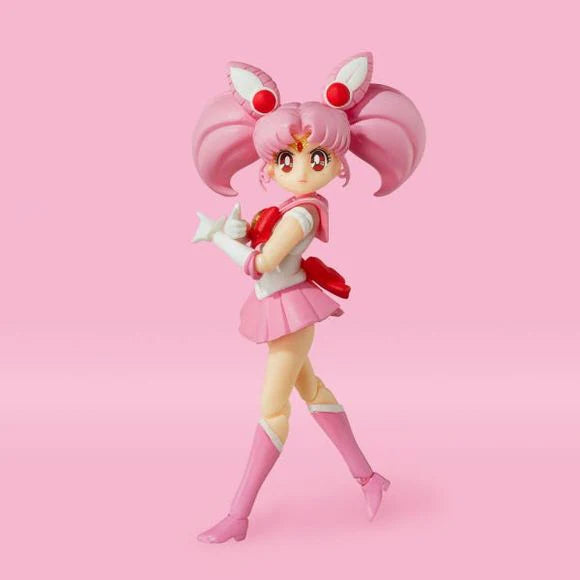 Bandai Sailor Chibi Moon action figure with pink hair and sailor outfit posed on pink background
