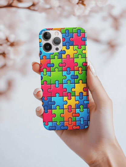 Colorful autism puzzle piece phone case design featuring vibrant puzzle patterns
