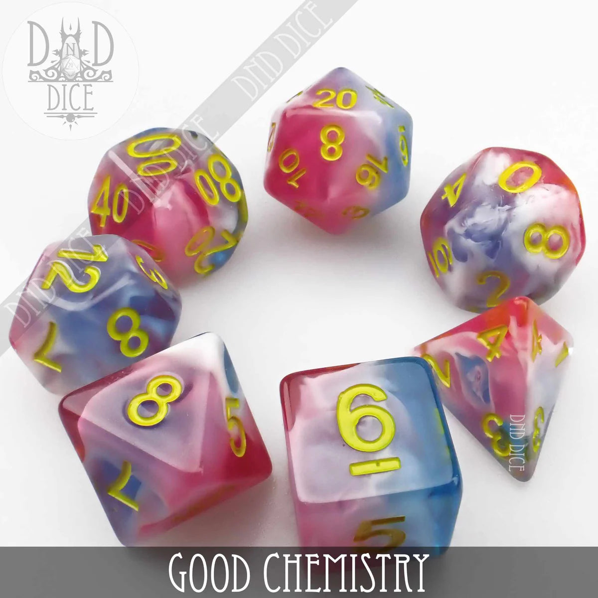 Colorful resin dice for tabletop games featuring vibrant pink and blue designs with golden numbers