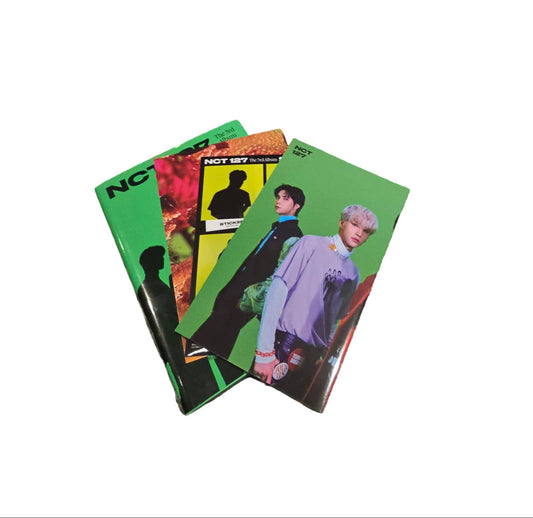 NCT 127 Sticker album pre-owned featuring vibrant designs and group images for fans