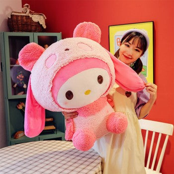 My Melody plush 18 inch large pink Sanrio character plush held by smiling woman in cozy dining room setting